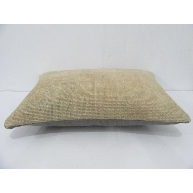 Decorative pillow cover made from a vintage Turkish handknotted rug. Backed with good quality cotton fabric. Pillow...