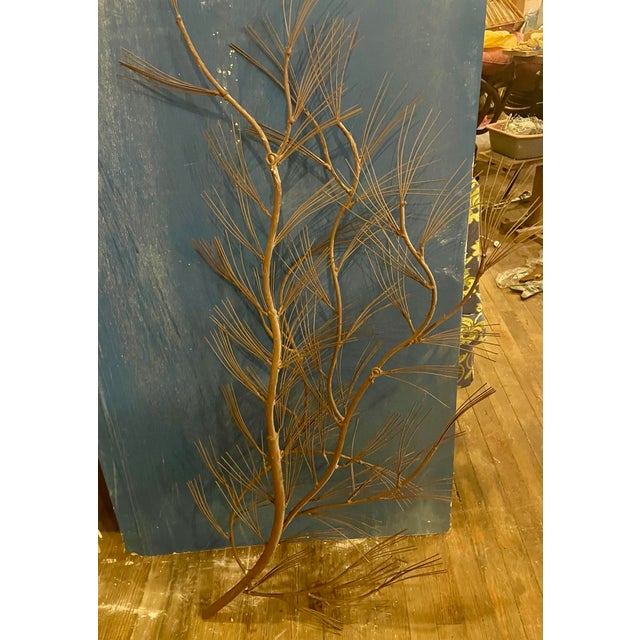 What a fun realistic and quality made pine tree branch wall decoration with a fabulous bark finish and pointy gold pained...