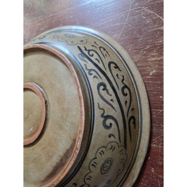 Celedon stoneware antique style Thai bowl.with fish among vines design.