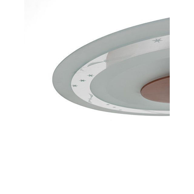 There is something almost celestial about this Swedish Modern ceiling lamp from the 1940s. At first glance, the design...