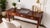 Beautiful cherry-finish writing desk featuring three functional drawers, classic brass hardware, and graceful Queen Anne-...
