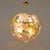 Contemporary italian sputnik chandelier, handcrafted in murano, featuring a radial polished brass frame embellished with...