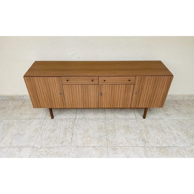Vintage Formica sideboard by 3k mobel, featuring four storage doors and two drawers. Dimensions: H76 W178.5 D43