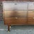 Newly refinished pair of Harvey Probber dresser in walnut. This piece comes with brass accents on the legs and all six...