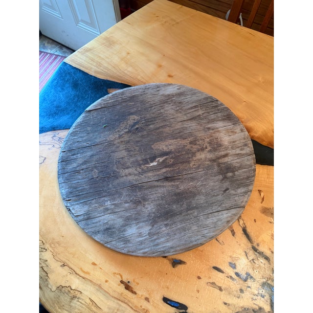 This is a rare and beautiful piece. It is solid would and has a diameter of 15.5”. It does have signs of its age and wear....