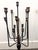 A dramatic pair of candelabras from Vagabond Vintage, each boasting thirteen elegantly tiered arms that evoke the grandeur...