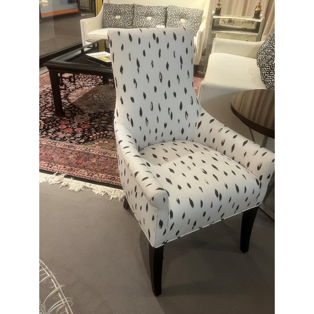 A Delicate Occasional Chair perfect at a desk. The back is detailed with buttons showing off a softly shaped back and...