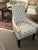 A Delicate Occasional Chair perfect at a desk. The back is detailed with buttons showing off a softly shaped back and...