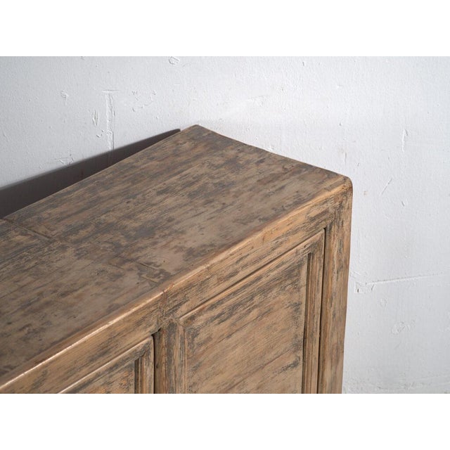 Low two-door sideboard in pine wood, originating from the Chinese province of Gansu and dating from around 1930. A piece...
