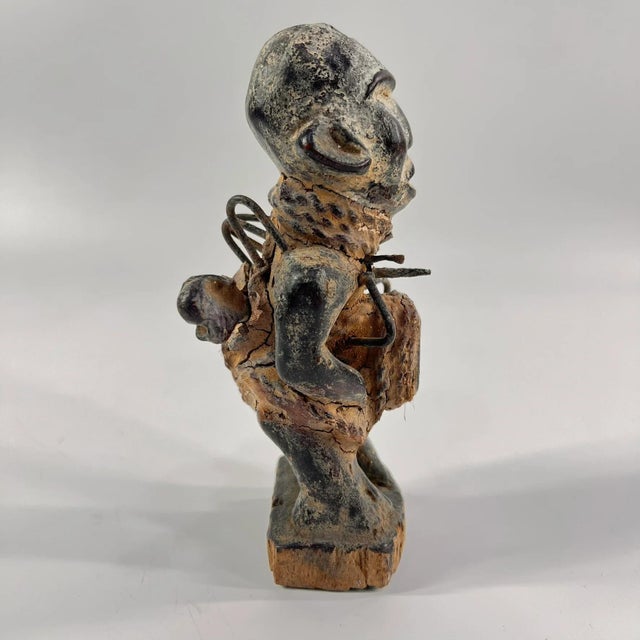 The Kongo Nkisi Nkondi Power Fetish Figure from Congo is a striking, handcrafted spiritual object used in rituals to...