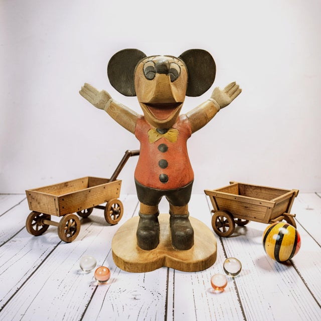 Hand-carved folk art Mickey Mouse sculpture featuring assembled wood construction and hand-painted surface decoration....