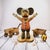 Hand-carved folk art Mickey Mouse sculpture featuring assembled wood construction and hand-painted surface decoration....