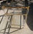 Vintage 1980s brass shelve table, with lucite acrylic legs. 3 Tempered beveled glass inserts. A mid-century gem attributed...