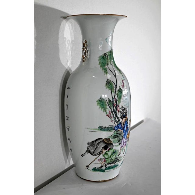 Important porcelain vase with flared collar, the part of which is decorated with a scene of country life. Close to a...