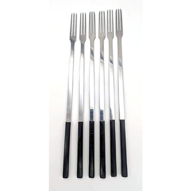 Offered is a set of six Spring brand #9039 stainless steel and black resin fondue forks made in Switzerland in the 1960s....