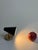 This stylish set of two wall lamps embodies the timeless charm of 1960s Scandinavian modernism. The lamps impress with...