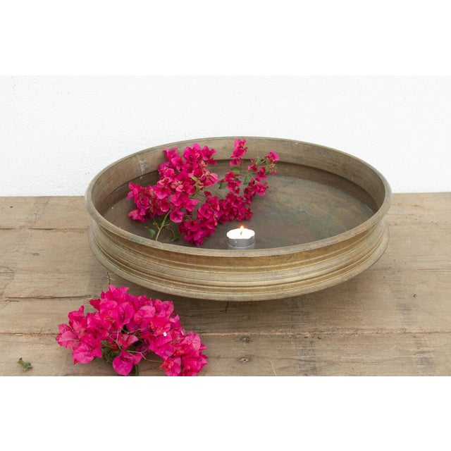 This 24-inch Urli is a remarkable specimen of traditional South Indian metalwork, hand-cast using ancient lost-wax...