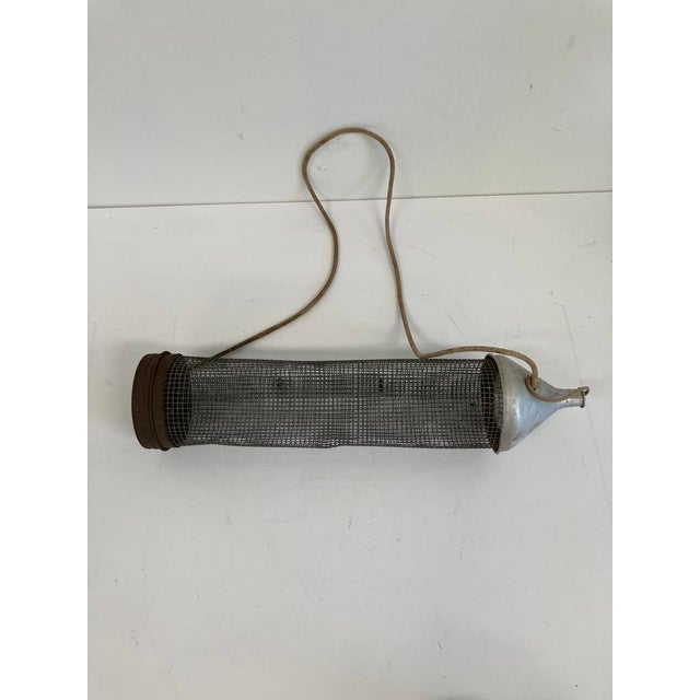 Age: Circa 1930s–1950s Material: Wire mesh body with tin funnel ends and rope handle Authentic vintage minnow trap dating...