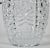 Vintage pressed glass ice bucket with intricate pattern and saw tooth rim. The bucket is 5.5" tall and 6" at the widest...