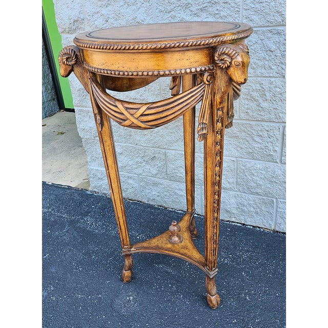 20th Century Neoclassical Style Fruitwood Rams Head and Leather Top Pedestal / Side Table. Measures 24" in width, 24" in...