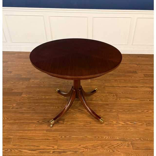 This is a one-of-a-kind round walnut foyer/occasional table bench-made in the Leighton Hall shop in Suwanee, Georgia. It...