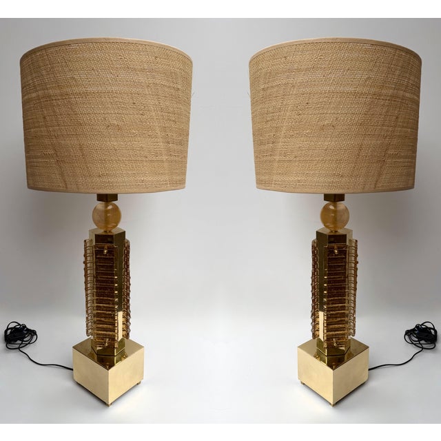 Pair of table or bedside Blade Robot lamps in brass and Murano glass with gold leaf powder. Contemporary work from a small...