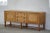 An elegant Danish Modern sideboard from the 1950s-60s, crafted in beautifully figured oak with a warm patina. The piece...