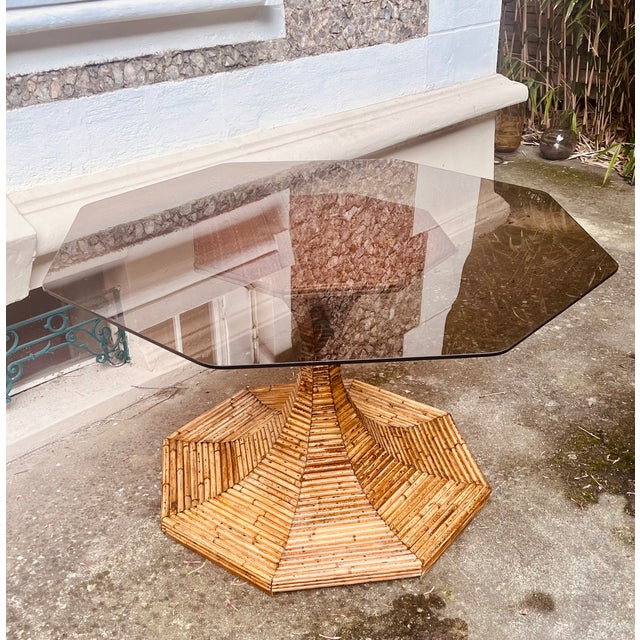 Splendid rattan table with smoked glass top. Made by Vivai del sud in the 1970s. This piece is attributed to the mentioned...