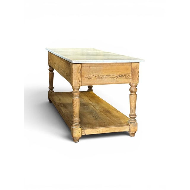 Antique French kitchen table, circa 1900. Made of thick pine with turned legs, it features two large drawers supporting a...