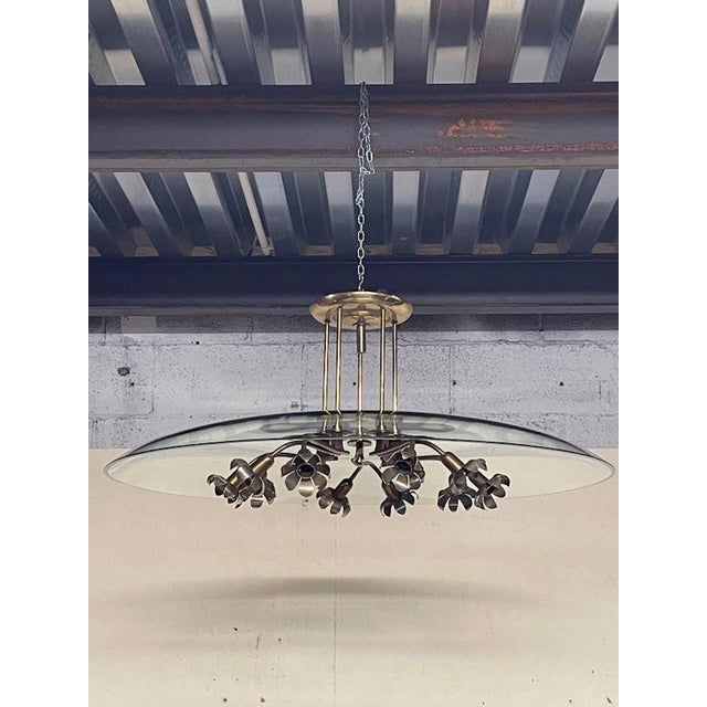 An elegant chandelier from the 1940s, widely attributed to the renowned Milanese designer Pietro Chiesa for Fontana Arte....