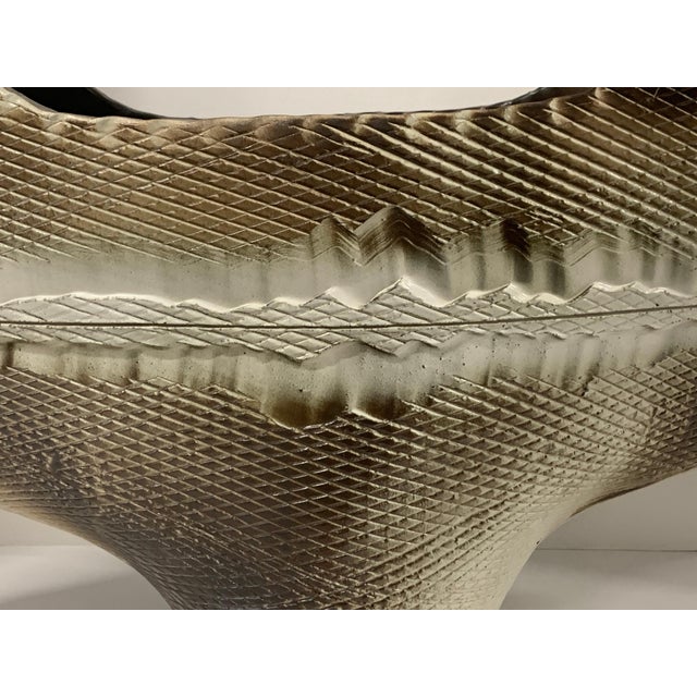 Beautiful Japanese stoneware pottery vessel. It is signed on the base in characters. Nice glaze and wonderful form. In...