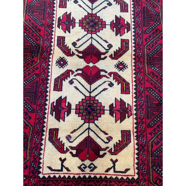 Nice 20th century Afghan rug with a geometric design and beautiful colors with beige, red, green, purple and black,...