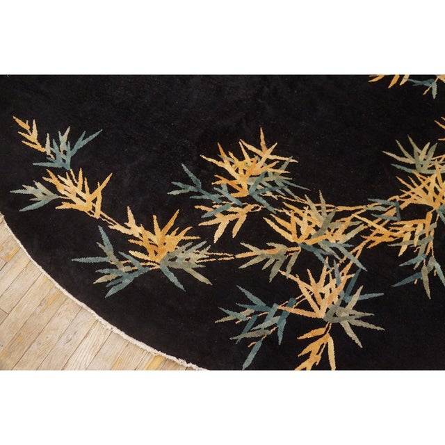 Antique Art Deco Chinese Floral Black 1920s Rug, Circa Date: 1920s. This exceptional piece captures the dramatic fusion of...