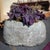 This stone basin was carved by hand nearly two centuries ago, sculpted from solid limestone with irregular texture and an...