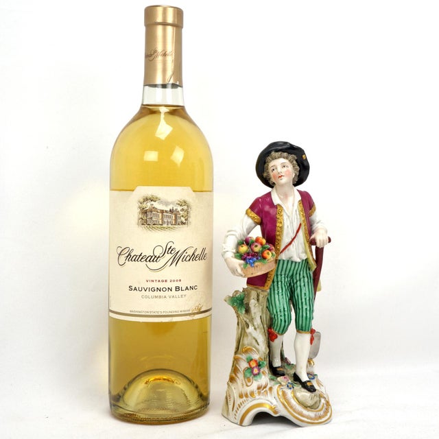 A colorful and detailed handmade vintage Capodimonte figurine of a youth. The quality of the figurine rivals that of...