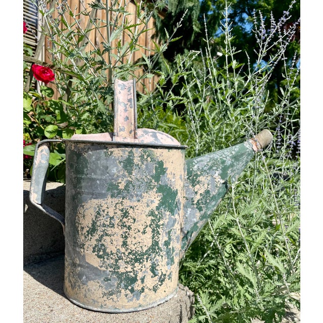 Early large Americana galvanized watering can with lovely old chippy paint. It has a wonderful rustic patina. This old...