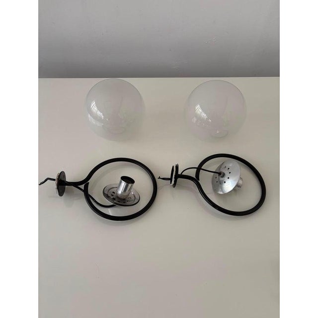 Pair of wall sconces by gino sarfatti, produced by arteluce a pair of elegant flush-mount wall sconces designed by gino...