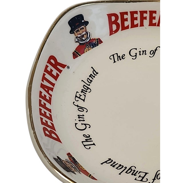 Excellent condition 1970s English Beefeater Gin pub change tray catchall, made by Wade PDM. Logo, lettering and gilt trim...
