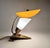Unique art deco table lamp made of brass and milk glass with original plastic shade. Rarely seen in this original...