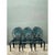 This set of six vintage outdoor dining chairs is cast in iron, each featuring an oval backrest filled with a striking,...