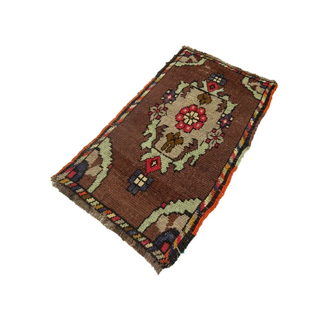 Vintage Handknotted decorative mini rug from Kars region of Turkey. Approximately 45-55 years old. In very good condition.