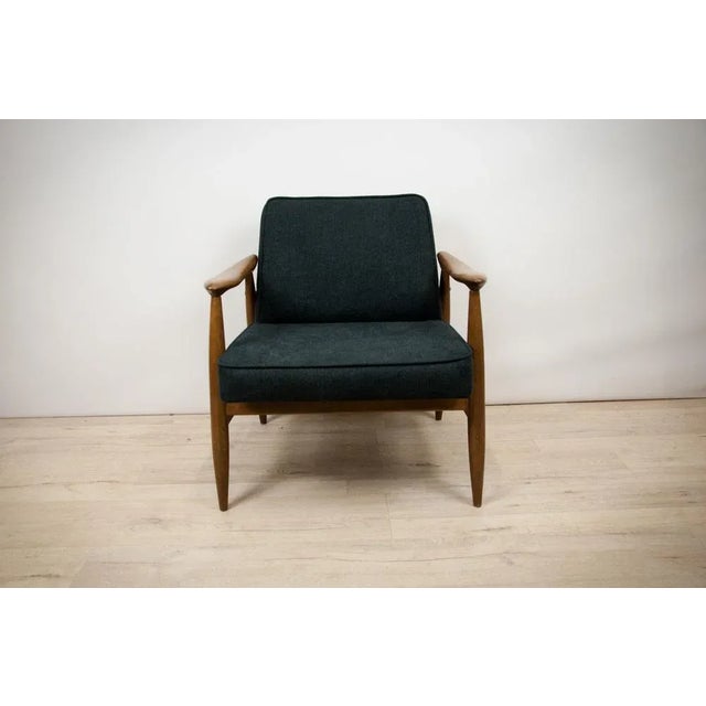 Polish armchair produced in Gościcińskie Fabryki Mebli in the early 1960s. This project, due to the specific profile of...