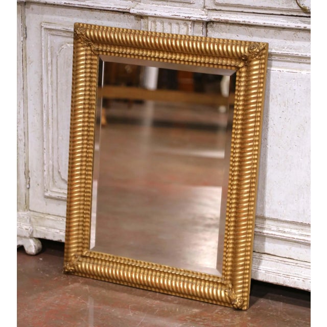 Crafted in France circa 1920, this refined Louis Philippe-style mirror features a rectangular giltwood frame with...