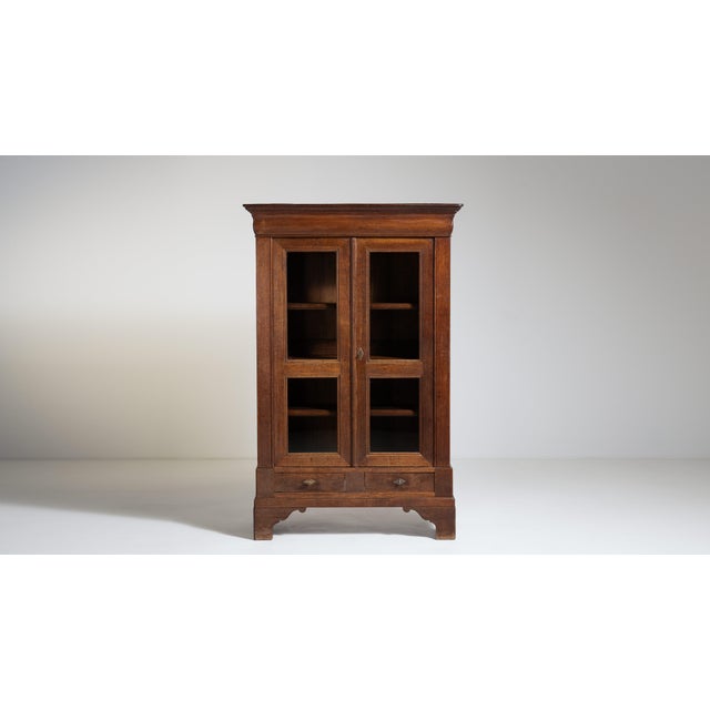 A late 19th century vitrine featuring original patina, which is particularly valuable as it reflects untouched surface...
