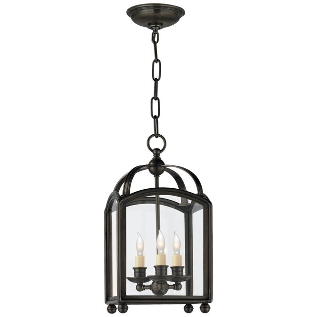 Arch Top Mini Lantern in Bronze Designer: Chapman & Myers Canopy: 5.75" Round Mounting: Chain Shade Detail: Clear Glass...