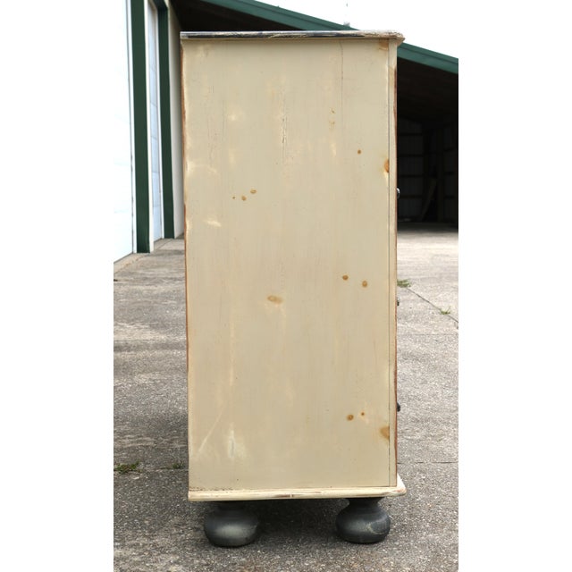 This dresser has a whitewashed body and black wash top and feet. The black drawer pulls also have a whitewash. I love the...