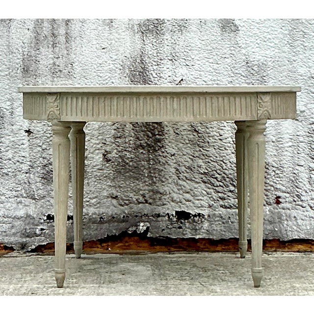 The Martell dining table by Zentique draws elegant inspiration from the timeless grace of 18th-century Gustavian design....