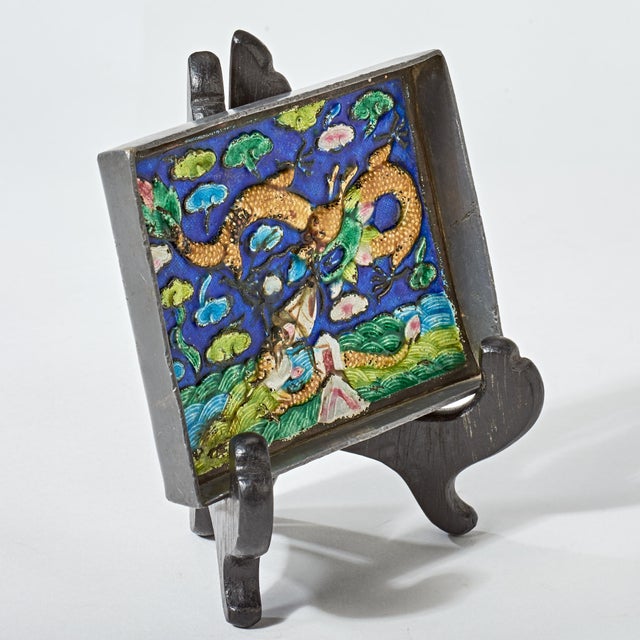 Nicely executed miniature scene of two dragons fighting over a seaside village. Enamel painting is mounted in a lead...