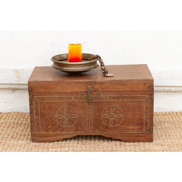 This vintage teak chest captures the romance of the old trade routes, featuring the robust construction of a traveler's...
