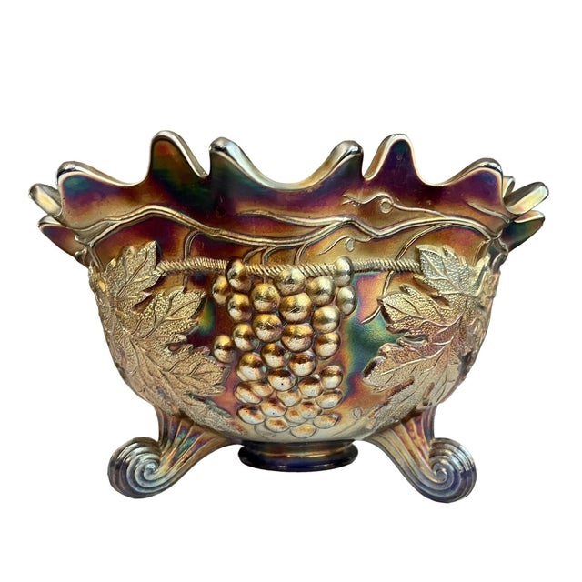 Gorgeous Antique Carnival Glass Footed Grape and Cable Fruit Bowl This stunning antique carnival glass bowl features a...